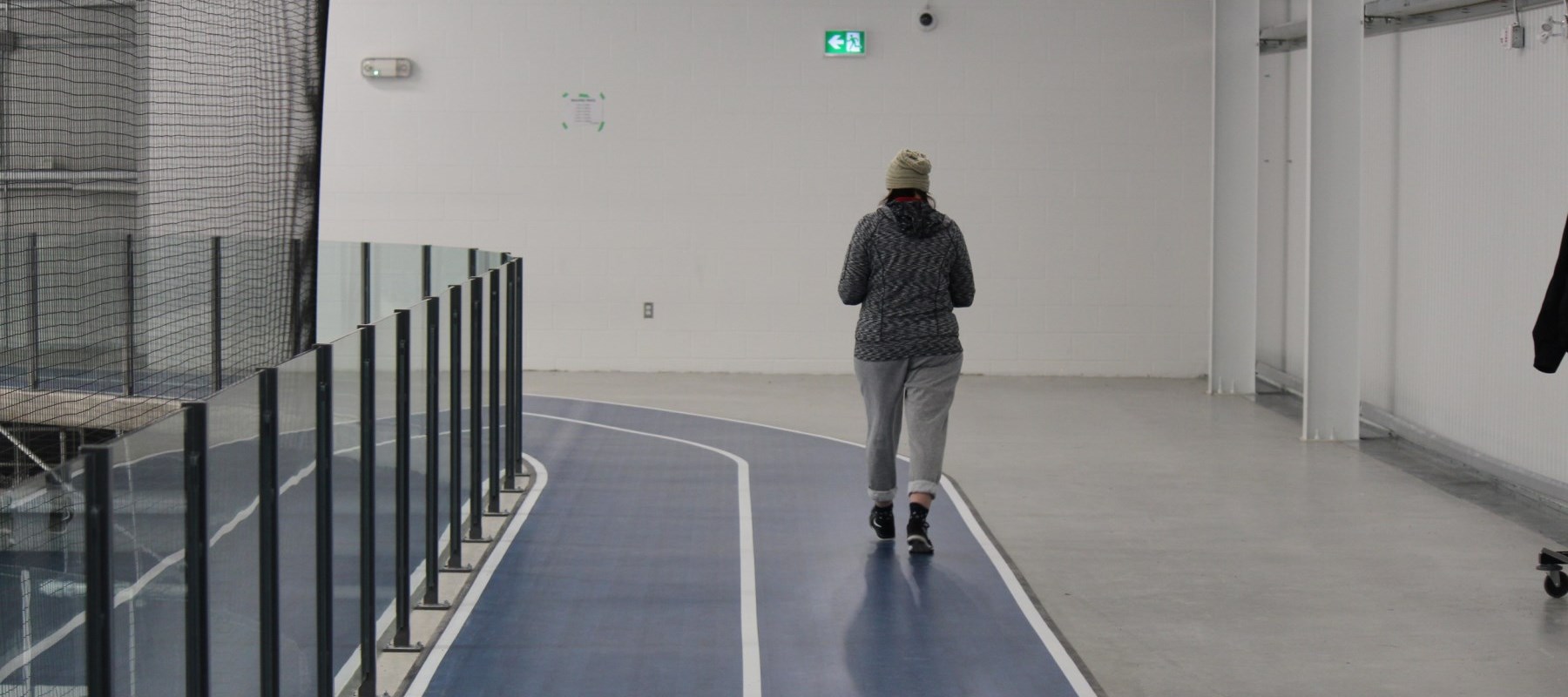 Resident using indoor walking track