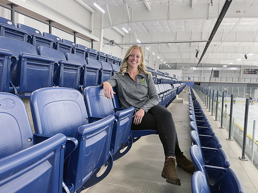 Woman sitting in arena