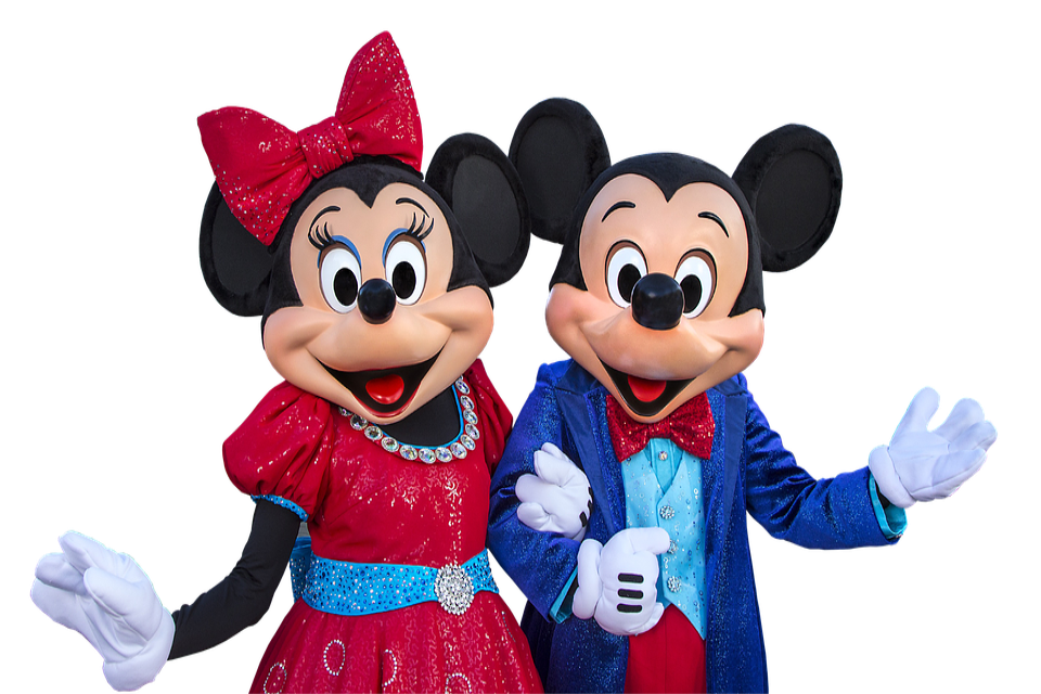 Disney's Micky and Minnie mouse wearing a blue suit and polk-a-dot dress respectively