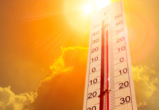 Sun and thermometer depicting hot weather