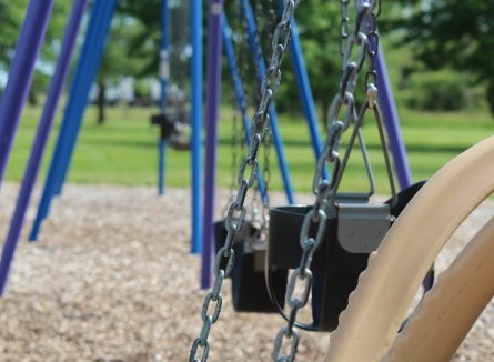 Close up of blue swings at Abingdon Park