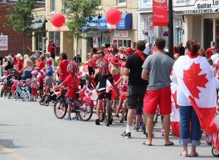 group of people in Canada Day decor celebrating