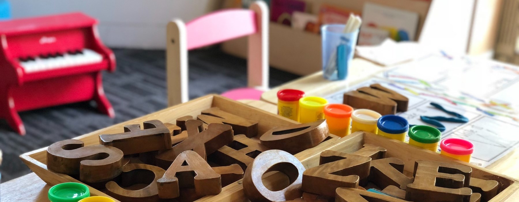 Play dough and block letters on a student's desk