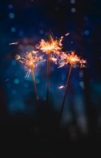 Person holding sparklers