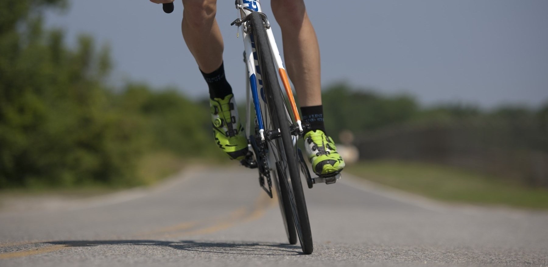 Man biking on country road