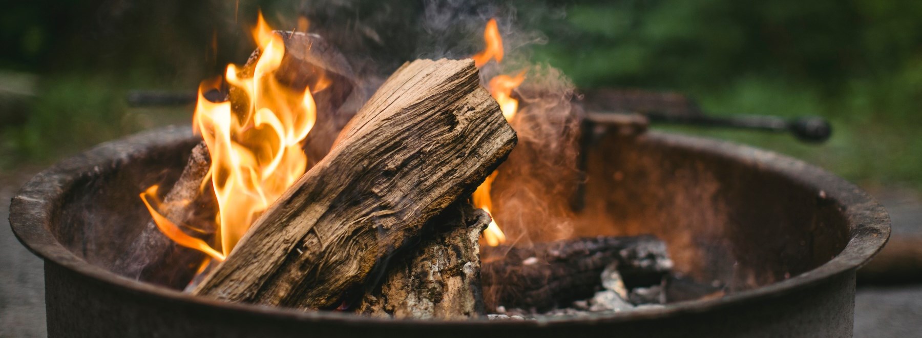 fire burning in metal bin outside