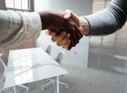 man and woman shaking hands after interview