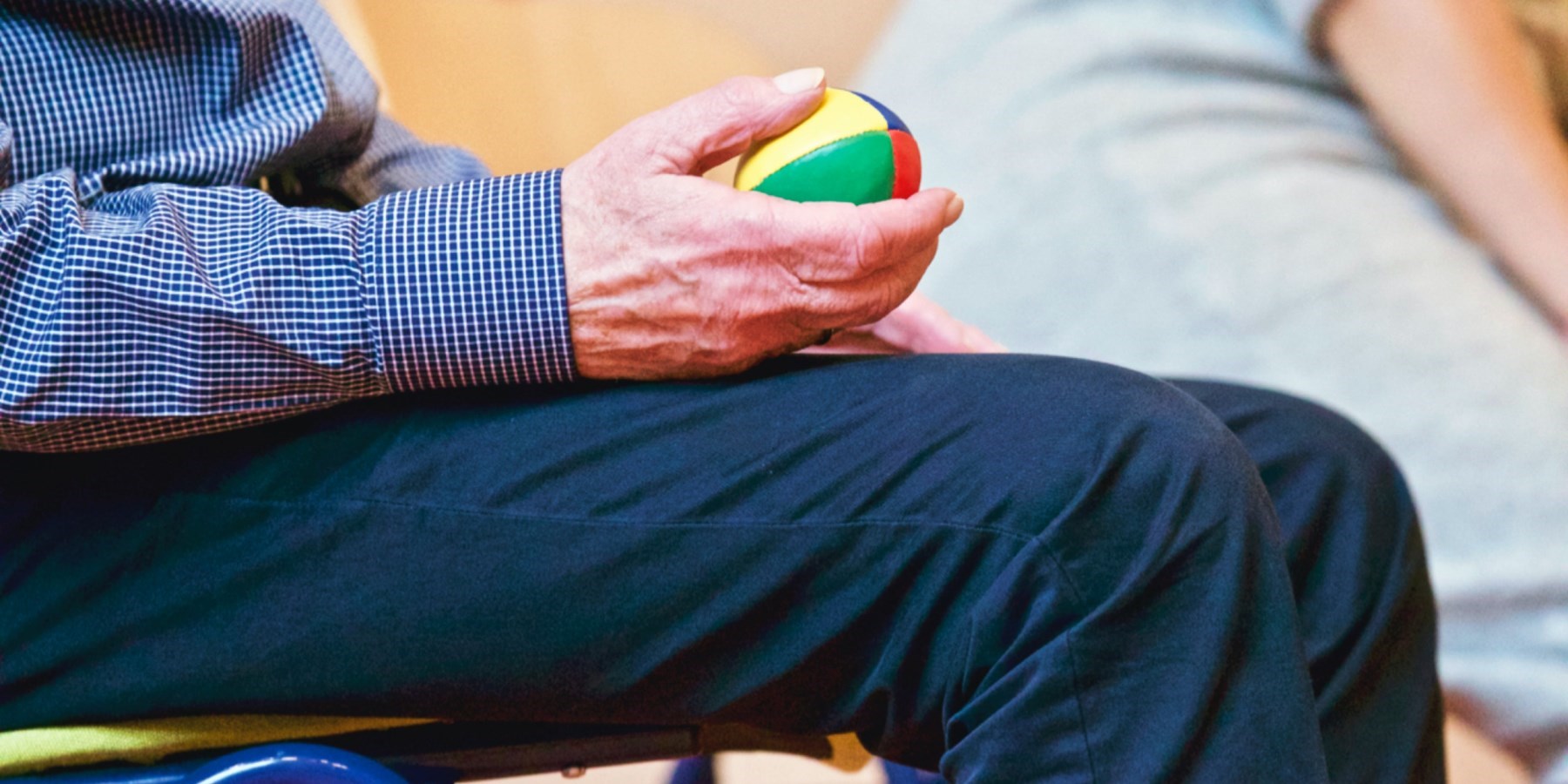 Senior man holding exercise ball