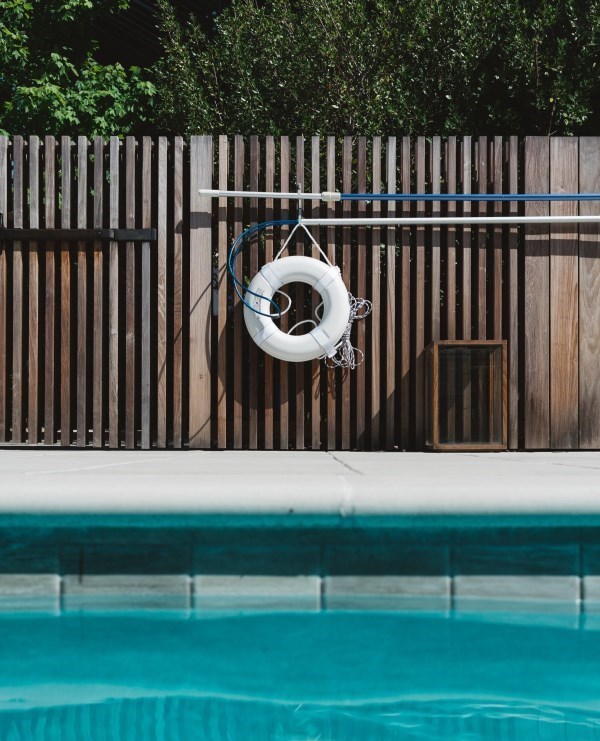 lifesaver hanging on pool enclosure